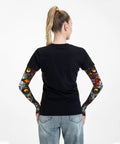 Back view of woman wearing Top Tier Ice Silk Cooling Arm Sleeves With Bold Fantasy Prints stays cool while gardening.