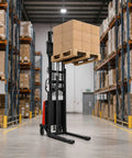 Walkie Pallet Stacker Semi Electric 3300 Lb Capacity 94 Inch Lift Height in a warehouse lifting stacked boxes.