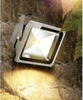 JUDYSSY Spot Lighting Led Flood Light Outdoor, Waterproof Security Lights mounted on wet stone wall, bright warm light.