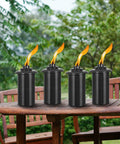 4 Pack Outdoor Metal Torch Set For Patio And Garden Decor Party Ready 59 Inch Tall Citronella Torch With Grounded 3 Prong Stake 16oz Fuel Capacity Table Top Or Yard Pathway Torches placed on a wooden table, showcasing metal construction and lit flames against a garden background.