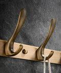 Top Shelf Vintage Brass Wall Mounted Coat Rack With Six Sleek Brushed Metal Hooks For Entryway Bathroom Bedroom And Closet Heavy Duty Towel Hanging Rail Built Tough To Grip Tight, showcasing three robust hooks.