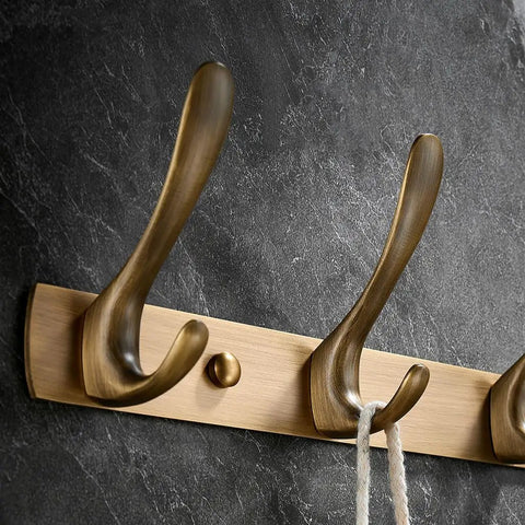 Top Shelf Vintage Brass Wall Mounted Coat Rack With Six Sleek Brushed Metal Hooks For Entryway Bathroom Bedroom And Closet Heavy Duty Towel Hanging Rail Built Tough To Grip Tight, showcasing three robust hooks.