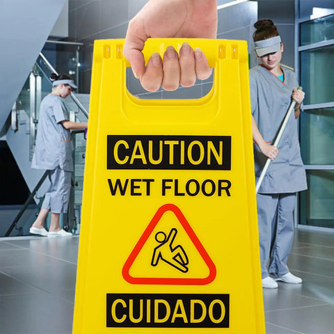 Caution Wet Floor Sign Yellow Double Sided A Frame, Bilingual Foldable Safety Sign 17.12 x 8.38 x 0.94 Inches in use in a public area