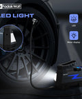 Portable 12V Car Tire Inflator Air Pump With LED Light and 150 PSI Digital Gauge, connected to car tire at night