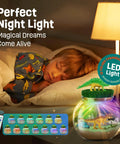 Child asleep beside Dinosaur Terrarium Kit For Kids With LED Night Light And Remote Control DIY Dino Toys Arts And Crafts Set.