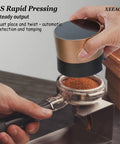Precision 58mm Espresso Tamper And Leveler Stainless Steel Barista Tool With Adjustable Twist Dial Compact Tamping Handle For Home Coffee Gear being used to tamp coffee grounds.