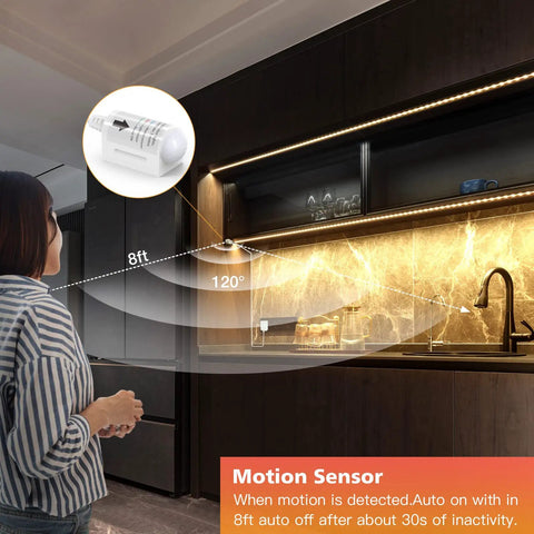Woman activating LED Strip Lights With Motion Sensor Remote And Adapter 16.4ft Warm White 3000K Dimmable Tape Lighting under cabinet