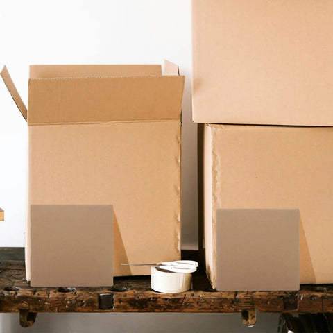 Corrugated Paper Pads 20x20cm with Protective Base Sturdy Cardboard Moving Box Filler Sheets displayed on wooden surface