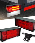 Front view of NeaLia boat trailer light box kit with red LED taillights, black housing and license plate bracket