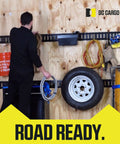 Man using Extended Flat J Hook E Track Ladder Hooks 4 Pack For Shed Garage Wall Hanger Accessories on wooden wall.