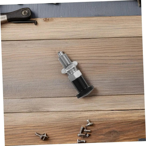 Built Damn Tough Stainless Steel Self Locking Indexing Plunger With Slick Spring Return Knob for precise jig alignment, laid on wood surface.