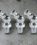 Close-up of metallic hydraulic nipples from Pro Grade 10 Piece Metric Grease Fittings Kit With 90 Degree Elbows And Hydraulic Nipples