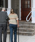 A Straight Up Rock Solid Wall Mounted Handrail Grab Bar For Indoor And Outdoor Steps, heavy duty white steel railing installed at porch steps.