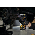 12V Max 3/8 Inch Cordless Impact Wrench Kit delivering hella tight torque in use for automotive repairs on a brake component.