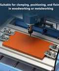 Heavy Duty T Slot Hold Down Clamp Made From Sturdy Zinc Aluminum Alloy For 3018 CNC Router securely clamping orange stock.