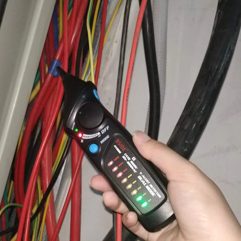 Person using Non Contact Voltage Detector Pen AVD06 12-1000V with LED indicator to check live wire in an electrical panel.