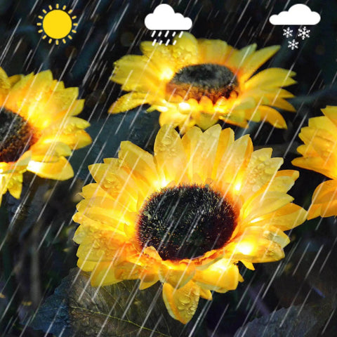 Upgraded 4 Flower Solar Sunflowers With Fairy Light Petals For Yard Decor under rainy conditions, showing waterproof feature.