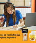 Woman writing at desk with Disposable Loose Leaf Tea Filters For Easy Brewing, Unbleached Paper Sachets in the foreground