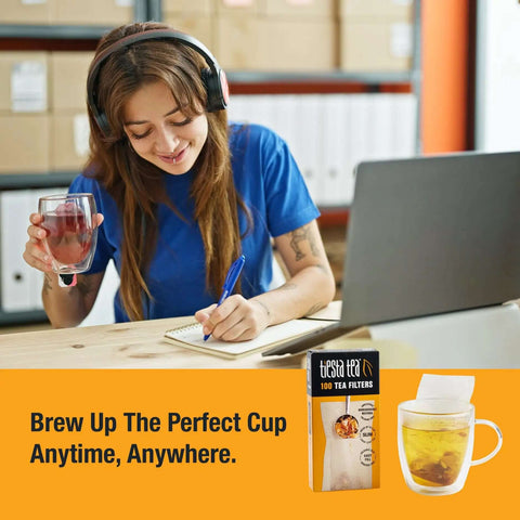 Woman writing at desk with Disposable Loose Leaf Tea Filters For Easy Brewing, Unbleached Paper Sachets in the foreground