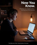 Person using Data Recovery And Investigation Tool For iPhone iPad And iPod Touch at a desk with laptop at night.
