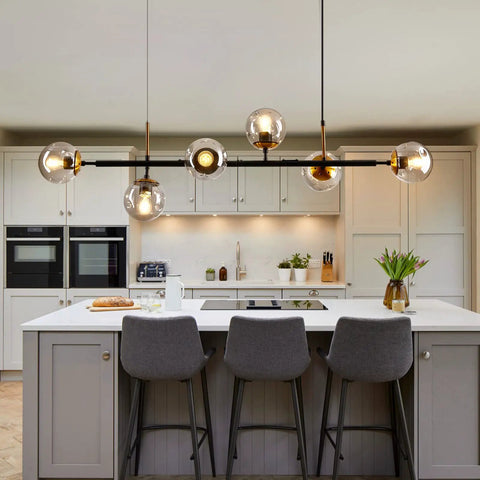 Mid-Century Glass Globe Pendant Light Fixture In Black And Gold, Semi-Flush Ceiling Chandelier in modern kitchen setting