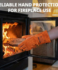 Heavy Duty 14 Inch Welding Gloves Heat Resistant Leather For Welding Fire Pit Campfire BBQ Grilling Oven Baking Mig Tig Stick Gear Gift For Dudes And Pros protecting hands while placing wood in a fireplace.