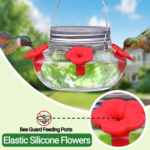 Hummingbird Feeder With Cute Mason Jar Design, Four Silicone Flower Ports, Top Fill, Leak-Proof, Easy To Clean And Refill, Outdoor Hanging Bird Feeder For Gardens Patios And Windowsills with red flowers and birds feeding.