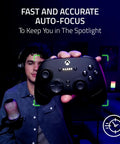 Premium 1440P 60 Fps Webcam With Lightning Fast Auto Focus For Seamless Streaming And Dope Video Calls Straight Up Game Changer USB plug and play camera focused on a user holding a Razer controller.