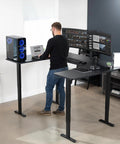 Rock Solid U Shaped Standing Desk Converters 83 By 60 Inches Black Sit Stand Converter for dual monitors in a modern workspace.