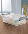 2.7 Quart Clear Plastic Storage Bin With Latching Lid And Write On ID Labels Stackable Modular Organizer For Home Garage Office And Craft Room Gray A Real Game Changer For Busy Homes on a desk