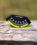 Close-up of 201-F Lev-O-Gage Inclinometer on wood surface, showing high visibility level gauge for off-road vehicles, USA made.