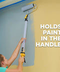 Person using EZ Roller With Long Reach Handle Holds 22 Oz In The Handle Inner Fed Paint Roller to paint a high wall corner