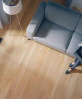 Living room floor with Lowkey Sleek Contemporary Artisan Style Vent Cover With Solid Cast Steel Interior, 4x12 inches, matte black.
