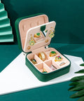 Compact Travel Jewelry Case With Mirror Portable Jewelry Box Organizer For Girls And Women All In One Travel Jewelry Box With 6 Ring Rolls And 3 Necklace Clasps Easy Carry No Tangle Storage Green Gift displayed open with jewelry inside