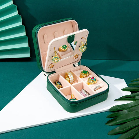 Compact Travel Jewelry Case With Mirror Portable Jewelry Box Organizer For Girls And Women All In One Travel Jewelry Box With 6 Ring Rolls And 3 Necklace Clasps Easy Carry No Tangle Storage Green Gift displayed open with jewelry inside