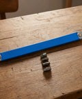 Premium Heavy Duty Offset Extension Wrench Rock Solid High Carbon Steel Construction with interchangeable socket adapter on wood.