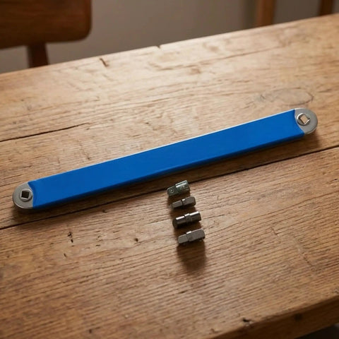 Premium Heavy Duty Offset Extension Wrench Rock Solid High Carbon Steel Construction with interchangeable socket adapter on wood.