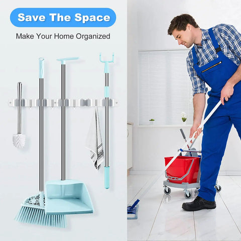 Broom And Mop Holder Wall Mount Organizer With Five Racks And Four Hooks, Heavy Duty Stainless Steel used in a home setting with mop and bucket.