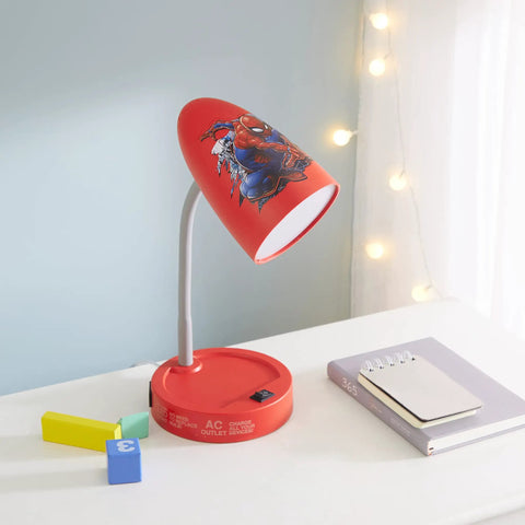 Spiderman Switch Operated LED Desk Lamp With USB Charging Outlet For Kids on a table, showing red shade with comic graphics.