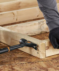 IsoCore 22 Oz Milled-Face Framing Claw Hammer used on wooden frame, demonstrating shock reduction grip and vibration control