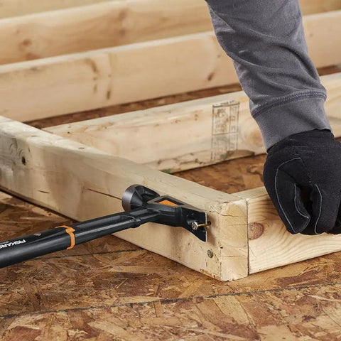 IsoCore 22 Oz Milled-Face Framing Claw Hammer used on wooden frame, demonstrating shock reduction grip and vibration control