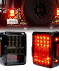 4D Smoked LED Tail Lights for 2007 to 2018 Jeep Wrangler JK JKU installed rear view with lit indicators and reverse lights, DOT approved