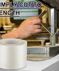 Roll of urethane die protection film near a metal bending machine, hand visible adjusting a metal piece, 4 inch by 0.030 inch film.