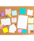 Top Shelf Upholstery Tacks In Glossy Green Coating For Sofa And Headboard Projects on a corkboard with colorful notes and pins.