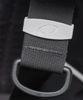 Close-up of Photon Pro Women's Back-Inflation BCD strap with modular harness and buckle, emphasizing material detail.