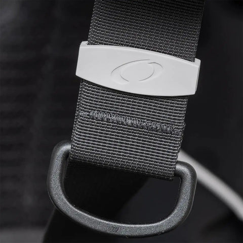 Close-up of Photon Pro Women's Back-Inflation BCD strap with modular harness and buckle, emphasizing material detail.