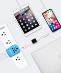 Universal USB Travel Power Adapter With Quad USB Ports And Type C for Worldwide Charging connected to multiple devices