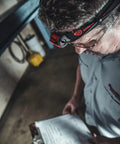 Man using Dual Light Source USB Headlamp Twin Task 375 Lumen Hands Free Night Work Light With Tilt Head in workshop