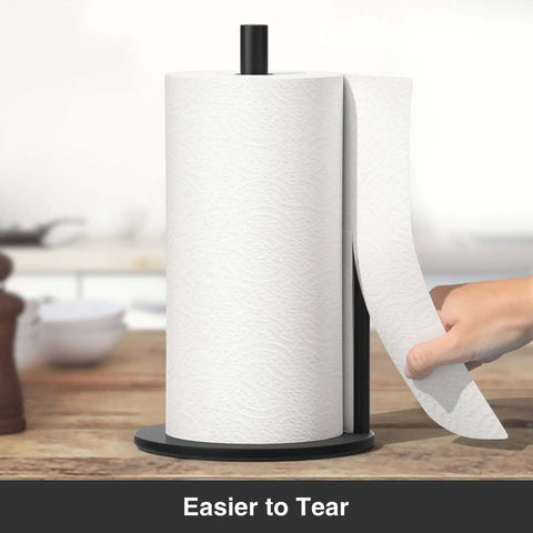 Matte Black Stainless Steel Paper Towel Holder With Weighted Base, hand tearing towel easily, on kitchen counter.