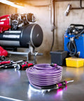 One Quarter Inch Polyurethane Air Hose Reinforced Lightweight Compressor Tubing Finish Safe And Slick Built Tough With Zero Drag For Auto Repair And Real Shop Grind Daily on a workbench.